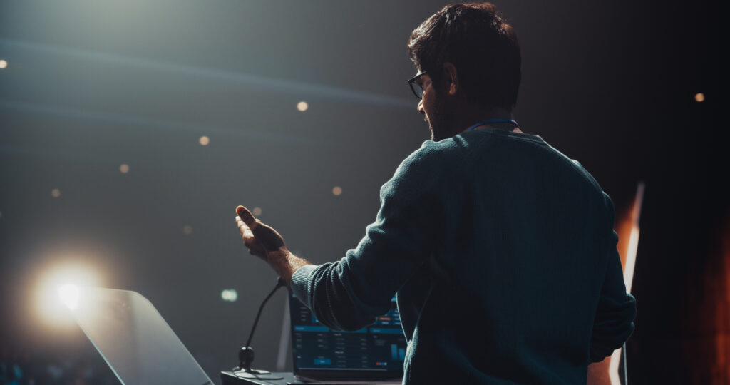 Expert Standing Behind a Podium Stand
